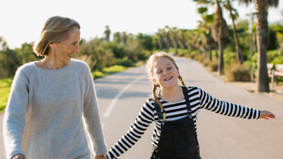 Grandma and Granddaughter walking down road